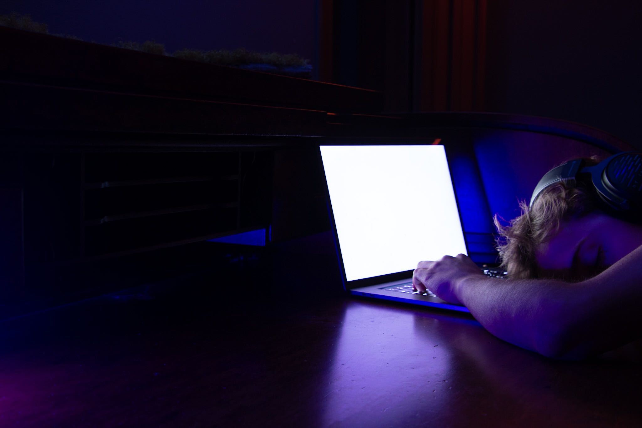 Julian Mudd asleep at his computer